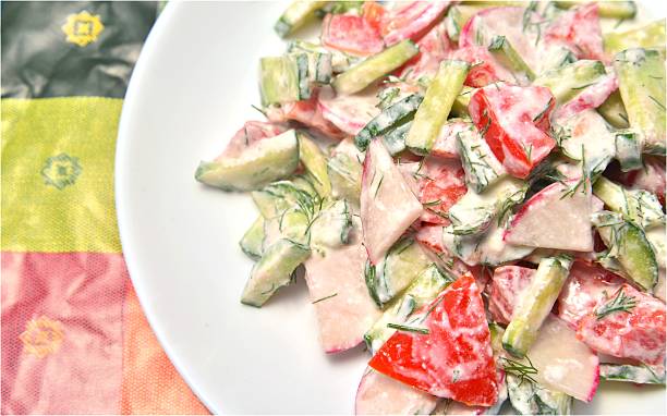 istock Russian salad with cucumbers, tomato, radish and sour cream 452388247