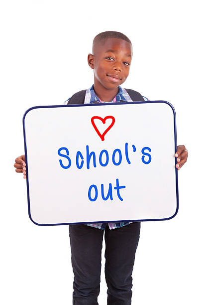 istock African American school boy holding a blank board 452394301