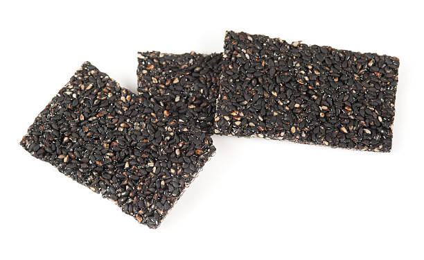 istock Honey bars with black sesame seeds isolated on white background 452399985