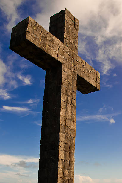 Christian Cross Against Blue Sky stock photo