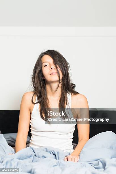 Tired Young Woman Waking Up After Sleep Stock Photo - Download Image Now - Adult, Adults Only, Beautiful People