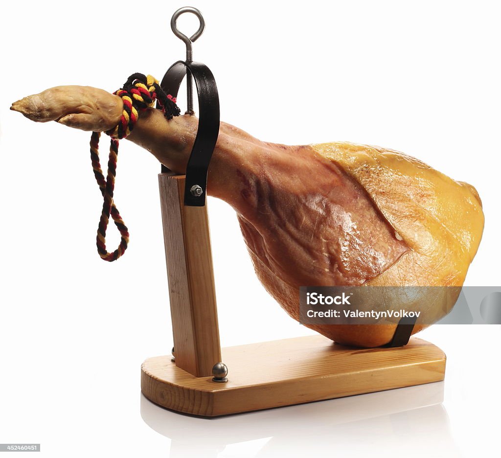 Ham on a wooden board. Ham on a wooden board on a white background. Butcher's Shop Stock Photo