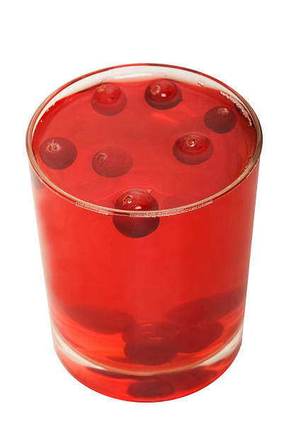 Red cranberry fruit drink Red cranberry fruit drink in the glass marshwort stock pictures, royalty-free photos & images