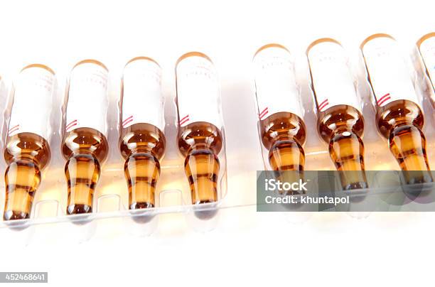 Brown Ampule In White Tray Background Stock Photo - Download Image Now - Blister, Glass - Material, Ampoule