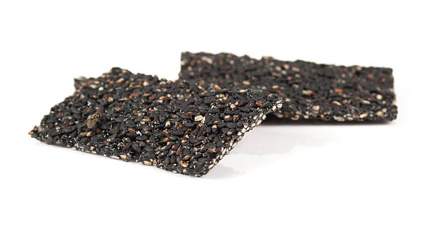 istock Honey bars with black sesame seeds isolated on white background 452475925