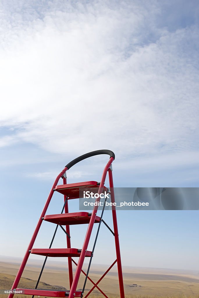 Ladder into sky In the blue sky white clouds feature in the background of the ladder Achievement Stock Photo