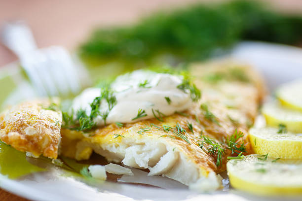 istock A close-up image of fried fish and lemon slices 452478837