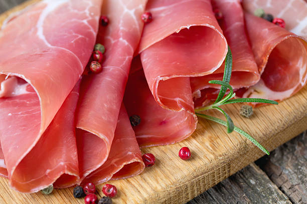 istock sliced prosciutto on a wooden board 452487361