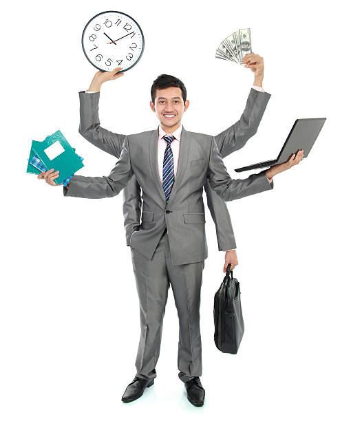 istock Businessman juggles many tasks at once with smile on face 452503373