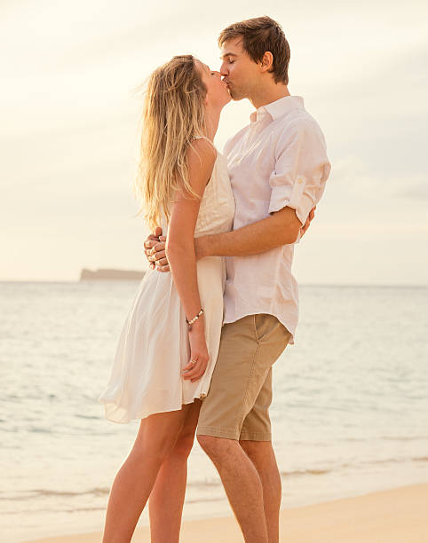 istock Happy romantic couple on the beach at sunset 452508973