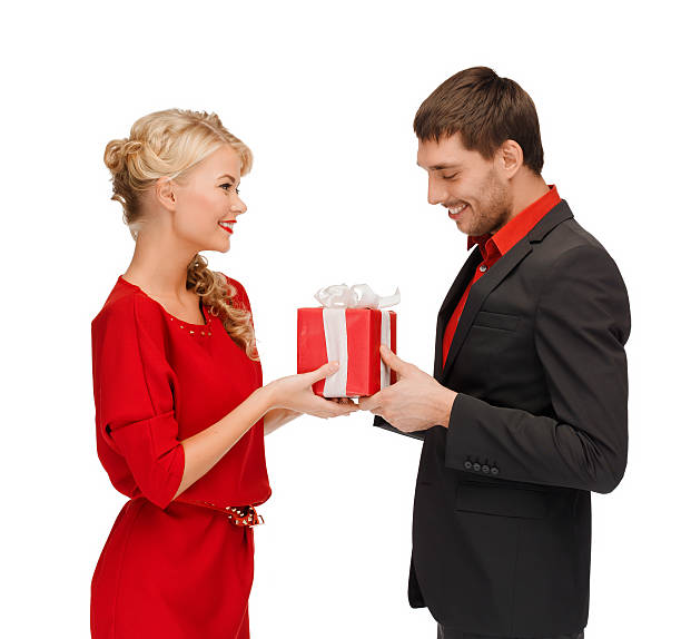 istock smiling woman and man with gift box 452512687