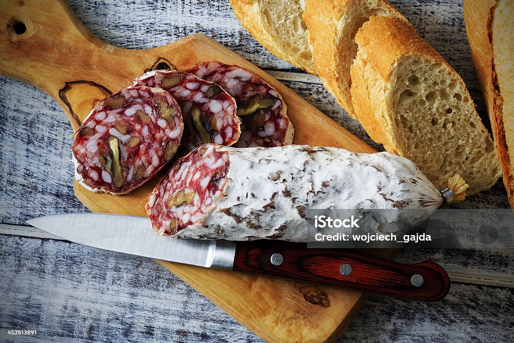 Salami with walnuts Salami with walnuts - Traditional Italian salamiTraditional Italian salami Baguette Stock Photo