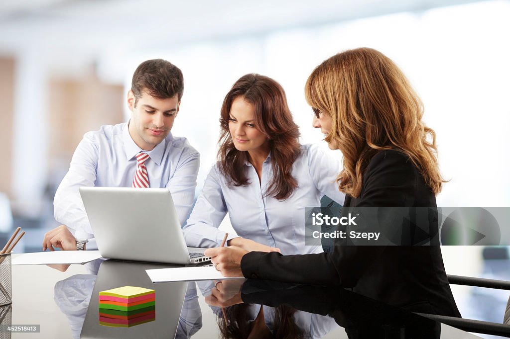 Working together in an office increasing productivity Contemporary business people working in team in the office Business Person Stock Photo