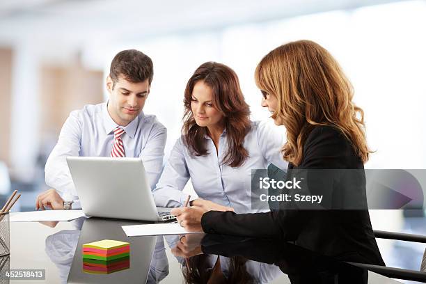 Working Together In An Office Increasing Productivity Stock Photo - Download Image Now