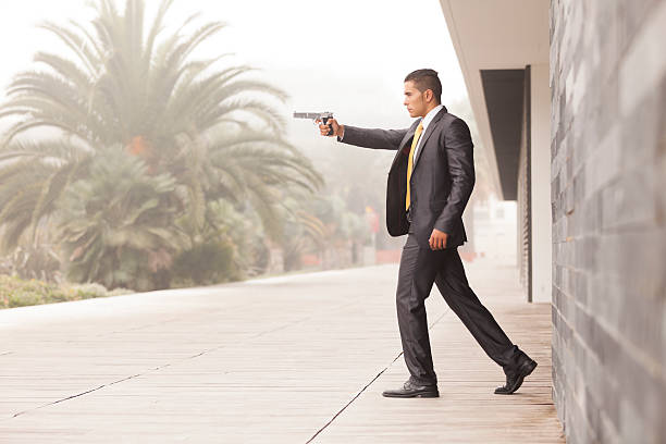 istock Security Businessman with a handgun 452518879