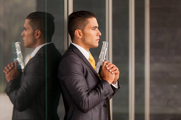 Security Businessman with a handgun stock photo