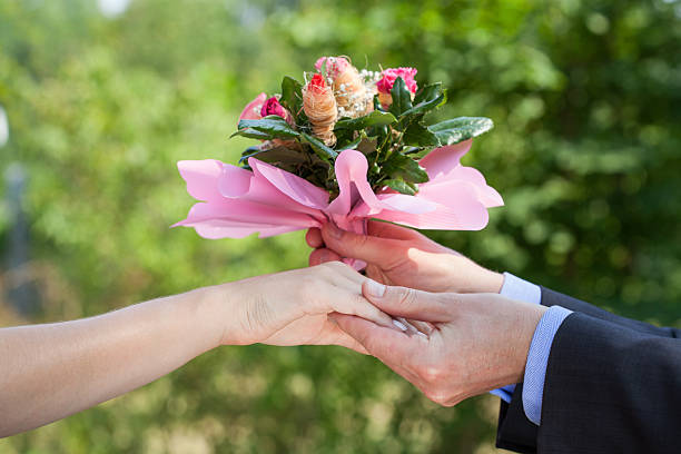 istock Couple with a bouguet 452519393