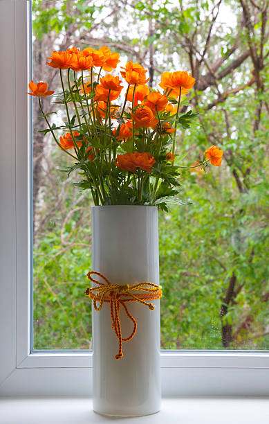 istock Vase filled by beautiful spring orange flowers 452524243