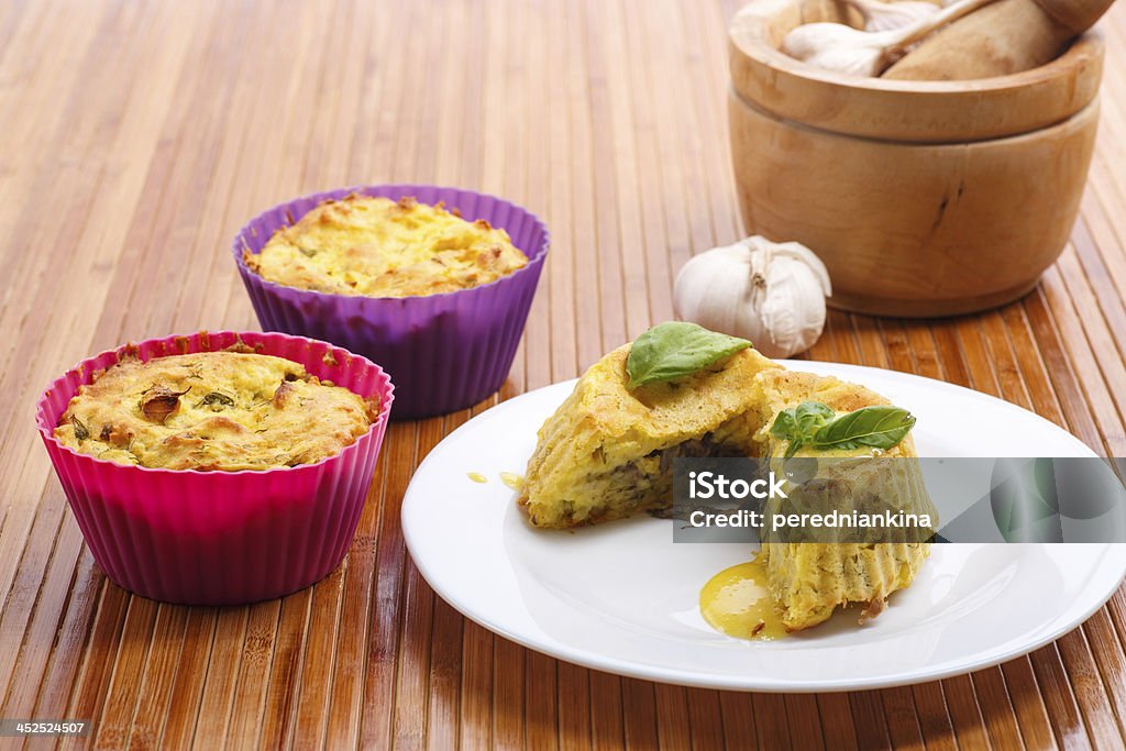 potato pudding potato pudding with mushroom stuffing on a white plate Appetizer Stock Photo