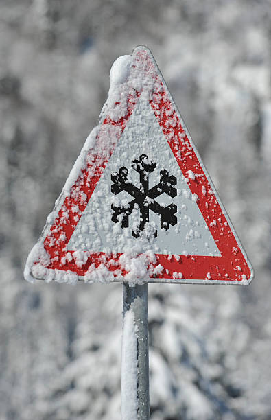 istock warning sign of ice and snow 452525217