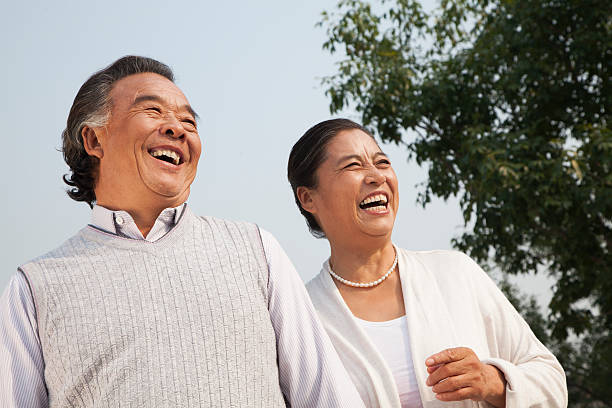istock Happy senior couple walking outdoors in Beijing 452531769