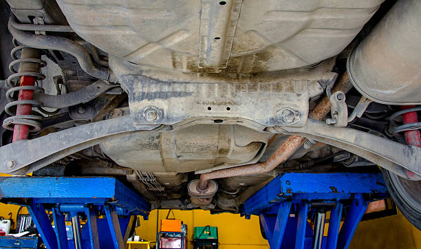 istock Car under repair on hoist at service station 452535209