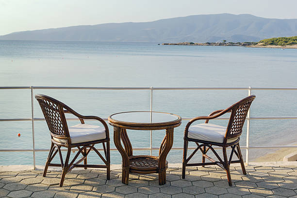 istock table and chairs overlooking the sea 452542349