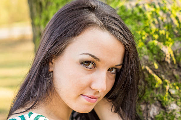 istock Young pretty woman in autumn park 452544319