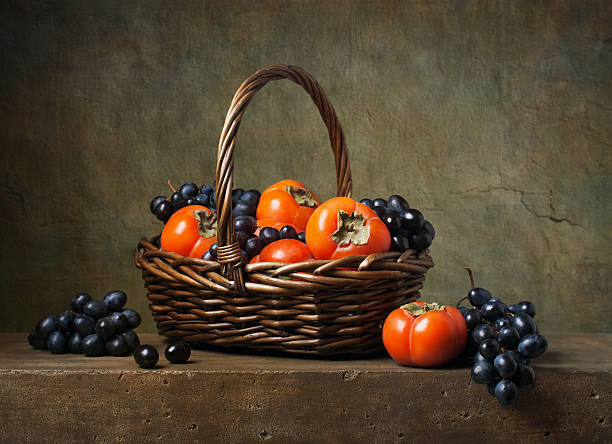 istock Still life with persimmons and grapes 452547115