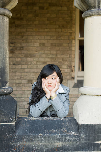 istock woman near pillars 452548045