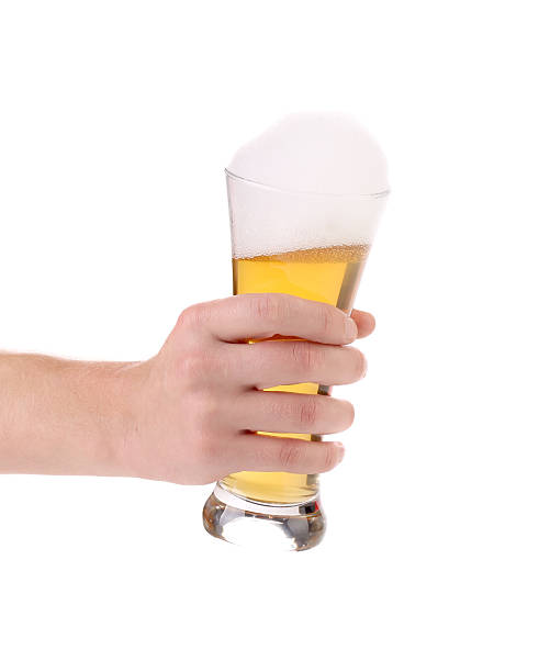 istock Hand hold of large glass with beer 452549187