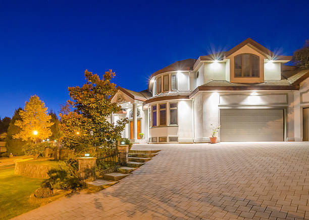istock Driveway view of huge house at dusk  452549205