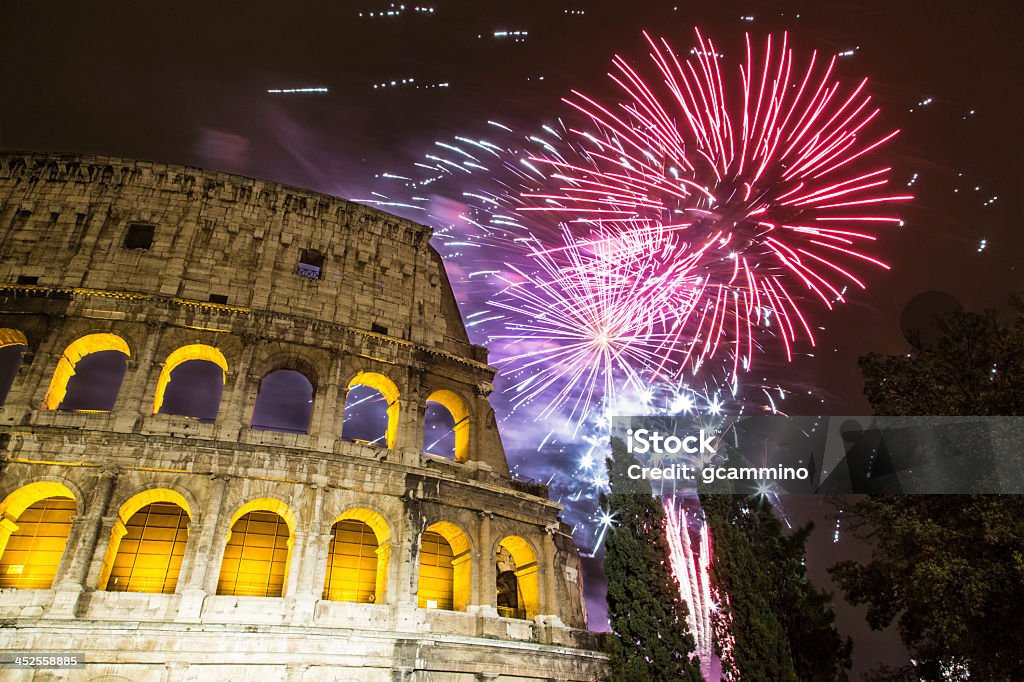 New Year's fireworks in the sky by the Colosseum in Rome Fireworks near the Colosseum in Rome. An event for the Chinese New Year. Firework Display Stock Photo