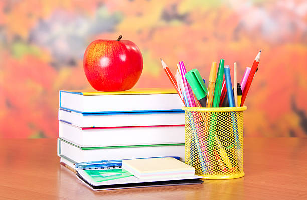 istock Pile textbooks and set of ball pens 452564313