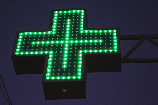 istock Neon green cross sign 452564691