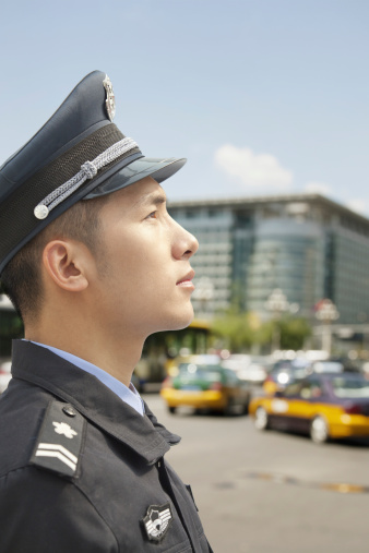 Police Officer looking up, profile