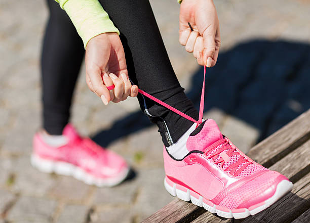 istock runner woman lacing trainers shoes 452570013