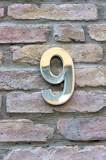 istock House number 9 zinc plate on brick wall 452570561