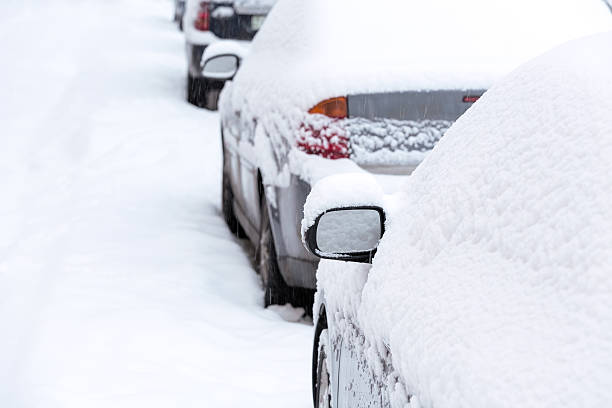 istock Snow covered cars in city 452574917
