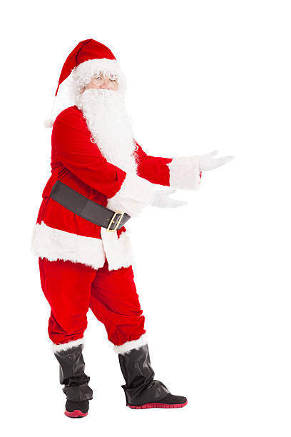 istock merry Christmas Santa Claus with welcome gesture 452577855