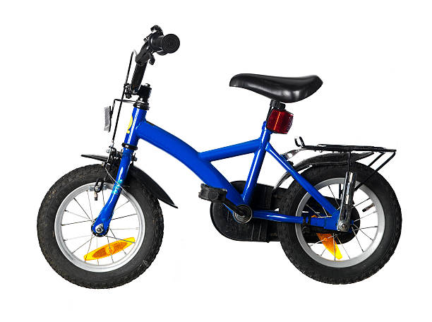Closeup photograph of a child's blue bicycle stock photo