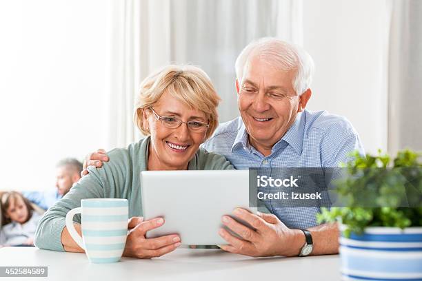Senior Couple With Digital Tablet Stock Photo - Download Image Now - 60-69 Years, Active Seniors, Adult