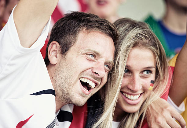 istock Sports fans cheering a game 452584619