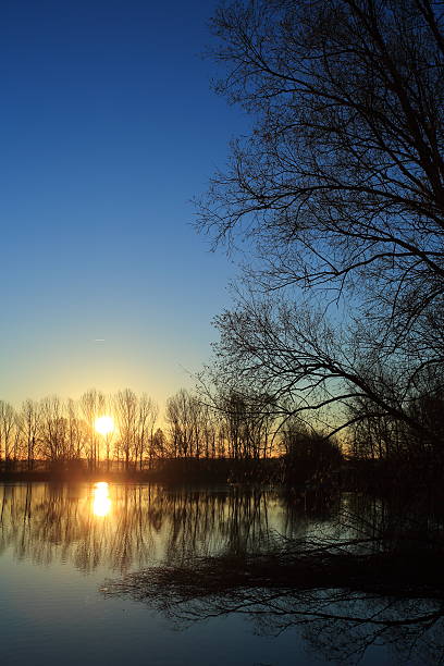istock Beautiful morning sunrise by Danish lake mirror effect 452585655