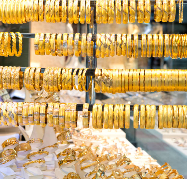 istock Golden bracelets on window display 452586335