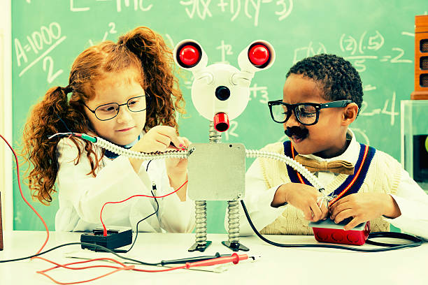 istock Education:  Retro revival children making robot in science lab. 452590333