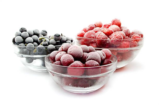 frozen fruit frozen fruit, frozen fruit background, red fruit frozen grapes stock pictures, royalty-free photos & images