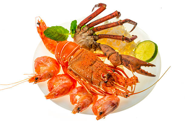 istock Spiny lobster, shrimps, crab legs  and rice 452595617