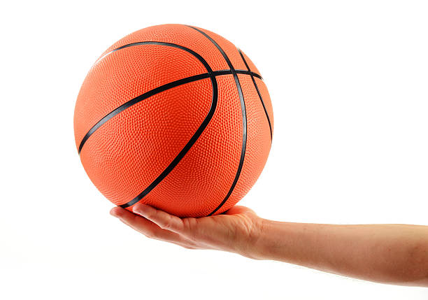 istock Hand and basketball isolated on white background 452599059