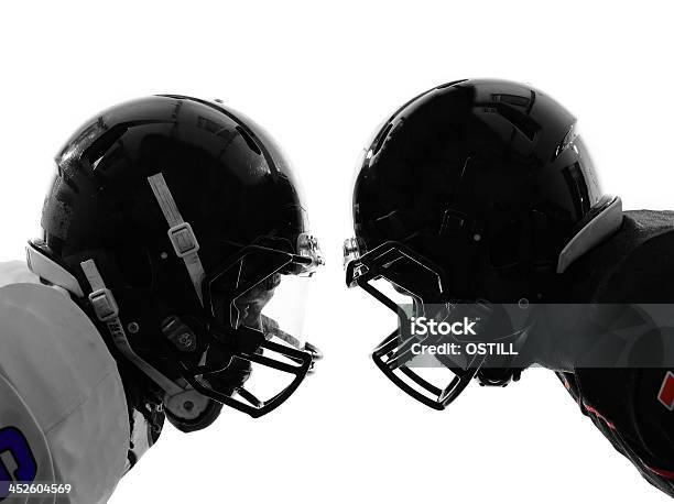 Two American Football Players Facing Eachother Silhouette Stock Photo - Download Image Now